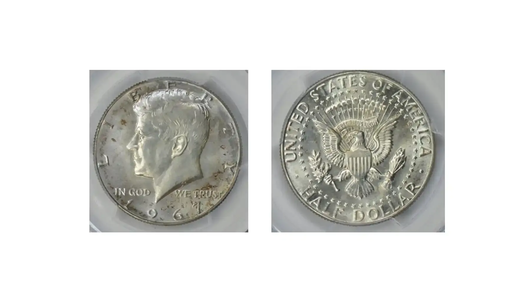 A picture of a 1967 Kennedy Half Dollar featuring a doubled die reverse, with noticeable doubling in the lettering and details.