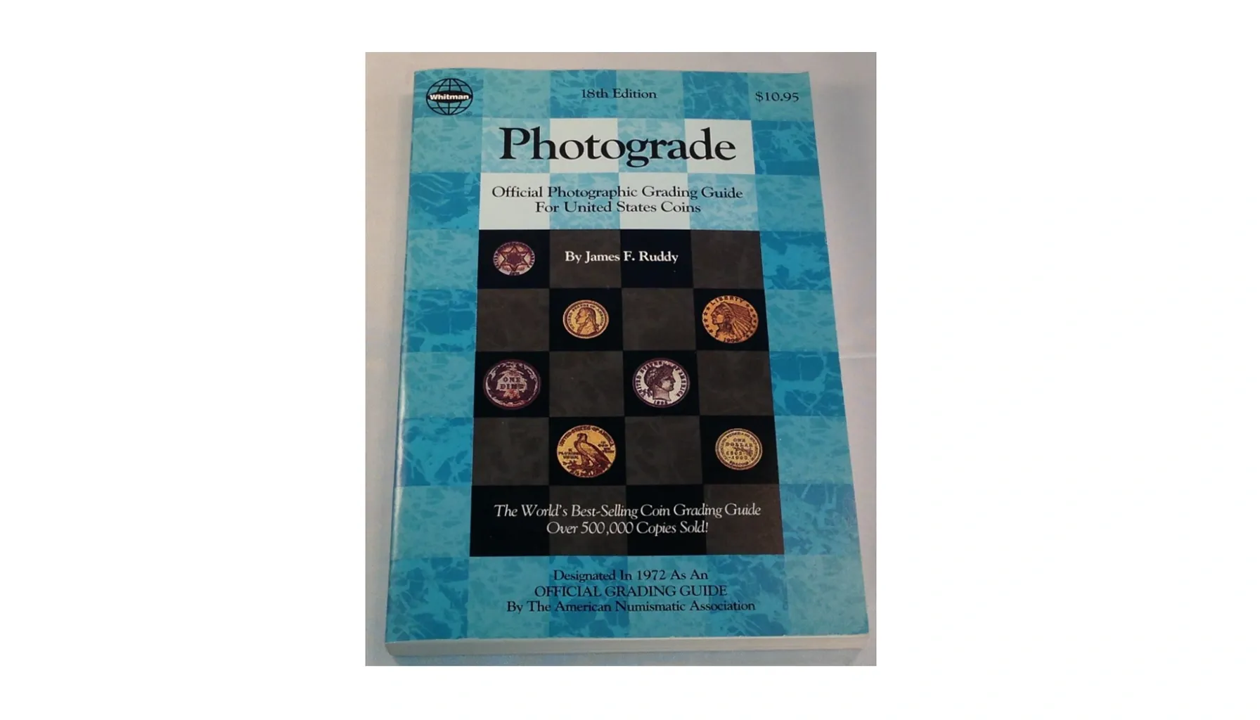 A cover of "Photograde" featuring clear, high-quality images of various coins to aid in grading and evaluation.