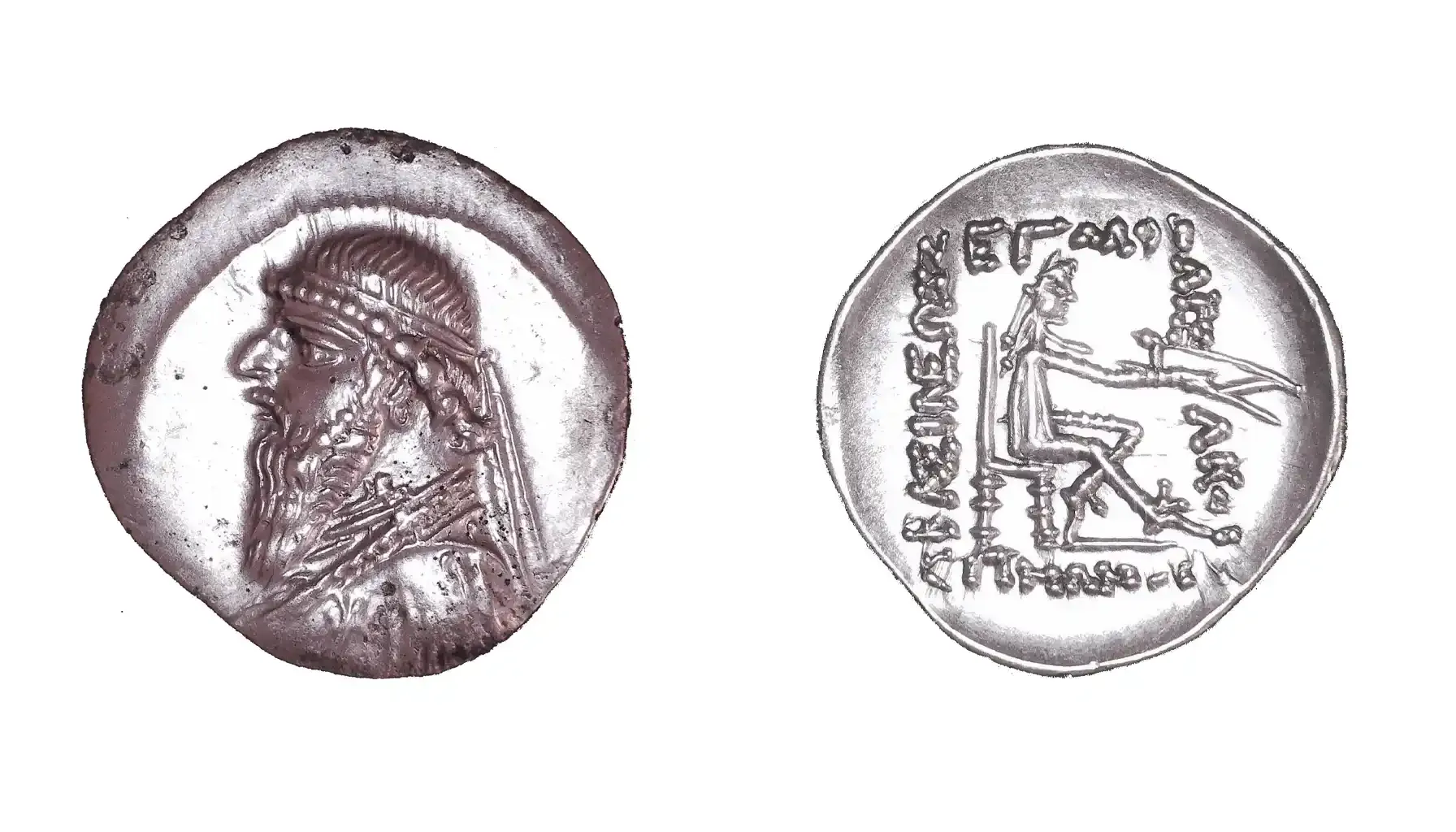 A picture of the Silver Drachm of Mithridates II, featuring a detailed portrait of the king wearing a royal diadem on the obverse, while the reverse depicts an archer seated, holding a bow.